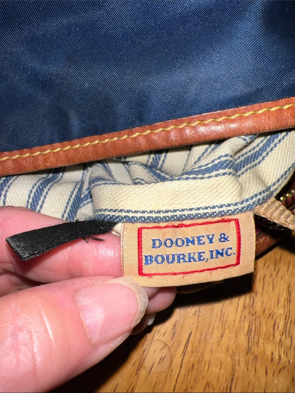 Dooney & Bourke Navy Nylon Messenger Bag with Brown Leather Trim and Red Accents